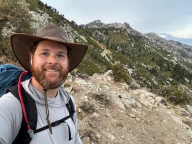 Brad Perkins, founder of The Dirt Brief, on a mountain trail